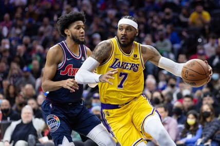Jan 27, 2022; Philadelphia, Pennsylvania, USA; Los Angeles Lakers forward Carmelo Anthony (7) dribbles past Philadelphia 76ers guard Isaiah Joe (7) during the second quarter at Wells Fargo Center. Mandatory Credit: Bill Streicher-USA TODAY Sports
