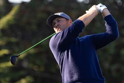 Feb 6, 2022; Pebble Beach, California, USA; Seamus Power plays his shot from the first tee during the final round of the AT&T Pebble Beach Pro-Am golf tournament at Pebble Beach Golf Links. Mandatory Credit: Bill Streicher-USA TODAY Sports