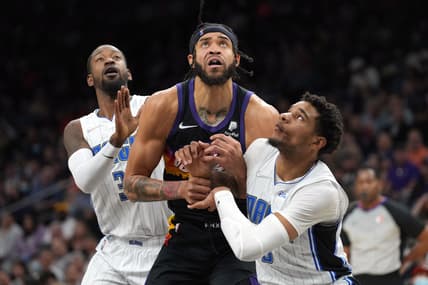 Feb 12, 2022; Phoenix, Arizona, USA; Orlando Magic forward Chuma Okeke (3) and Orlando Magic guard Terrence Ross (31) box out Phoenix Suns center JaVale McGee (00) during the second half at Footprint Center. Mandatory Credit: Joe Camporeale-USA TODAY Sports