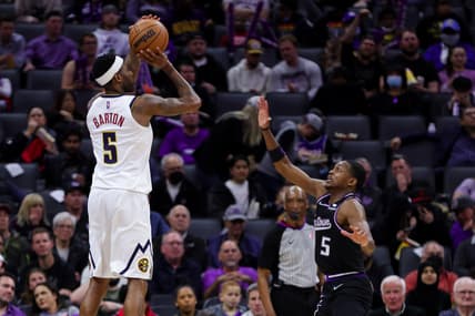 Feb 24, 2022; Sacramento, California, USA; Denver Nuggets forward Will Barton (5) shoots the ball over Sacramento Kings guard De'Aaron Fox (5) during the third quarter at Golden 1 Center. Mandatory Credit: Sergio Estrada-USA TODAY Sports
