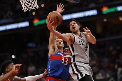 Feb 25, 2022; Washington, District of Columbia, USA; San Antonio Spurs forward Doug McDermott (17) shoots the ball as Washington Wizards forward Kyle Kuzma (33) defends in the second quarter at Capital One Arena. Mandatory Credit: Geoff Burke-USA TODAY Sports