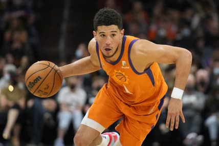Feb 25, 2022; Phoenix, Arizona, USA; Phoenix Suns guard Devin Booker (1) drives against New Orleans Pelicans in the second half at Footprint Center. Mandatory Credit: Rick Scuteri-USA TODAY Sports
