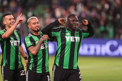 Feb 26, 2022; Austin, TX, USA; Austin FC forward Moussa Djitte (2) celebrates with midfielder Diego Fagundez (14) and midfielder Felipe Martins (22) after scoring Austin FC's fifth and final goal against FC Cincinnati at Q2 Stadium. Mandatory Credit: Aaron Martinez/American-Statesman via USA TODAY NETWORK