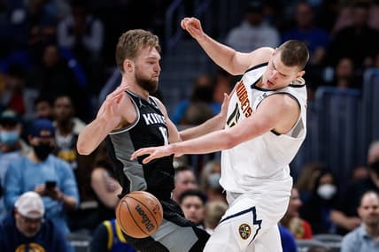 Feb 26, 2022; Denver, Colorado, USA; Denver Nuggets center Nikola Jokic (15) collides with Sacramento Kings forward Domantas Sabonis (10) in the fourth quarter at Ball Arena. Mandatory Credit: Isaiah J. Downing-USA TODAY Sports