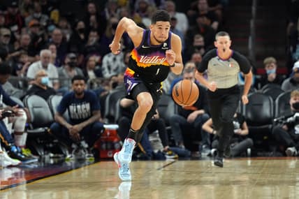 Feb 27, 2022; Phoenix, Arizona, USA; Phoenix Suns guard Devin Booker (1) dribbles against the Utah Jazz during the second half at Footprint Center. Mandatory Credit: Joe Camporeale-USA TODAY Sports
