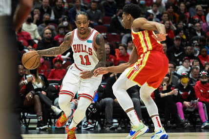 Feb 24, 2022; Chicago, Illinois, USA;  Chicago Bulls forward DeMar DeRozan (11) drives against Atlanta Hawks forward De'Andre Hunter (12) during the first half at the United Center. Mandatory Credit: Matt Marton-USA TODAY Sports