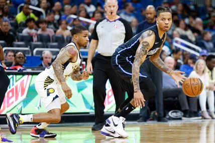 Feb 28, 2022; Orlando, Florida, USA;  Orlando Magic guard Markelle Fultz (20) controls the ball guard by Indiana Pacers guard Keifer Sykes (28) in the fourth quarter  at Amway Center. Mandatory Credit: Nathan Ray Seebeck-USA TODAY Sports