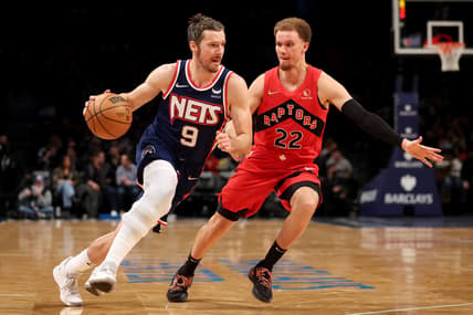 Feb 28, 2022; Brooklyn, New York, USA; Brooklyn Nets guard Goran Dragic (9) drives to the basket against Toronto Raptors guard Malachi Flynn (22) during the fourth quarter at Barclays Center. Mandatory Credit: Brad Penner-USA TODAY Sports