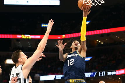 Feb 28, 2022; Memphis, Tennessee, USA; Memphis Grizzles guard Ja Morant (12) shoots during the second half against the San Antonio Spurs at FedExForum. Mandatory Credit: Petre Thomas-USA TODAY Sports