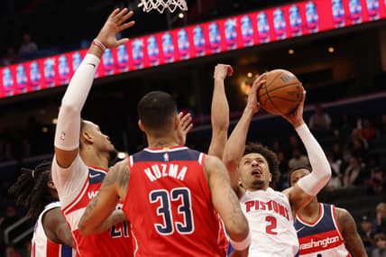 Mar 1, 2022; Washington, District of Columbia, USA; Detroit Pistons guard Cassius Stanley (2) shoots the ball as Washington Wizards center Daniel Gafford (21) and Washington Wizards forward Kyle Kuzma (33) defend in the first quarter at Capital One Arena. Mandatory Credit: Geoff Burke-USA TODAY Sports