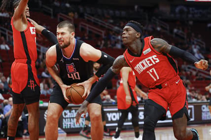 Mar 1, 2022; Houston, Texas, USA; Los Angeles Clippers center Ivica Zubac (40) attempts to control the ball as Houston Rockets guard Dennis Schroder (17) defends during the first quarter at Toyota Center. Mandatory Credit: Troy Taormina-USA TODAY Sports