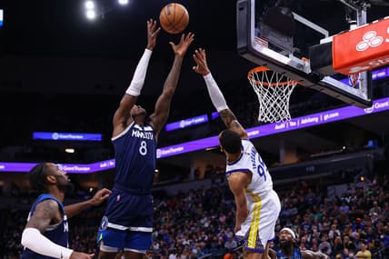 Mar 1, 2022; Minneapolis, Minnesota, USA; Minnesota Timberwolves forward Jarred Vanderbilt (8) rebounds the ball as Golden State Warriors forward Juan Toscano-Anderson (95) defends him during the second quarter at Target Center. Mandatory Credit: Harrison Barden-USA TODAY Sports