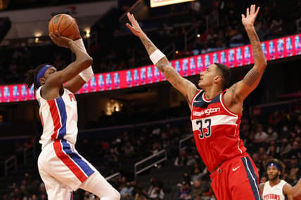 Mar 1, 2022; Washington, District of Columbia, USA; Detroit Pistons forward Jerami Grant (9) shoots the ball over Washington Wizards forward Kyle Kuzma (33) in the second quarter at Capital One Arena. Mandatory Credit: Geoff Burke-USA TODAY Sports