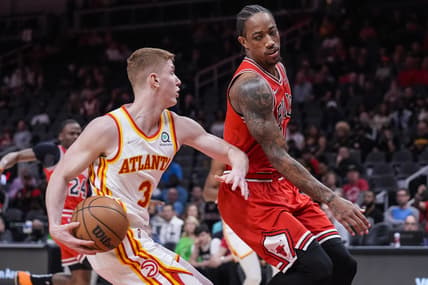 Mar 3, 2022; Atlanta, Georgia, USA; Atlanta Hawks guard Kevin Huerter (3) dribbles the ball against Chicago Bulls guard DeMar DeRozan (11) during the first half at State Farm Arena. Mandatory Credit: Dale Zanine-USA TODAY Sports