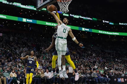 Mar 3, 2022; Boston, Massachusetts, USA; Memphis Grizzlies forward Jaren Jackson Jr. (13) blocks a shot attempt by Boston Celtics forward Jayson Tatum (0) during the first quarter at TD Garden. Mandatory Credit: Winslow Townson-USA TODAY Sports