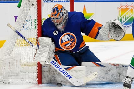 Mar 3, 2022; Elmont, New York, USA; New York Islanders goaltender Semyon Varlamov (40) makes a save against the Vancouver Canucks during the third period at UBS Arena. Mandatory Credit: Dennis Schneidler-USA TODAY Sports
