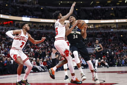 Mar 4, 2022; Chicago, Illinois, USA; Milwaukee Bucks forward Giannis Antetokounmpo (34) drives to the basket against Chicago Bulls forward Derrick Jones Jr. (5) during the first half at United Center. Mandatory Credit: Kamil Krzaczynski-USA TODAY Sports