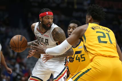 Mar 4, 2022; New Orleans, Louisiana, USA; New Orleans Pelicans forward Brandon Ingram (14) is defended by Utah Jazz guard Donovan Mitchell (45) and center Hassan Whiteside (21) in the first quarter at the Smoothie King Center. Mandatory Credit: Chuck Cook-USA TODAY Sports