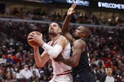 Mar 4, 2022; Chicago, Illinois, USA; Chicago Bulls center Nikola Vucevic (9) tries to shoot against Milwaukee Bucks center Serge Ibaka (25) during the second half at United Center. Mandatory Credit: Kamil Krzaczynski-USA TODAY Sports