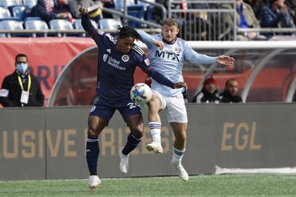 Mar 5, 2022; Foxborough, Massachusetts, USA; New England Revolution forward DeJuan Jones (24) battles FC Dallas forward Paul Arriola (7) for the ball during the first half at Gillette Stadium. Mandatory Credit: Winslow Townson-USA TODAY Sports