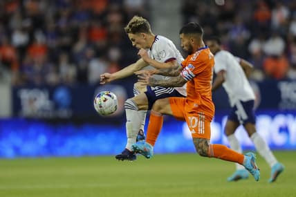 Mar 5, 2022; Cincinnati, OH, USA; D.C. United forward Griffin Yow (22) battles for the ball against FC Cincinnati midfielder Luciano Acosta (10) in the first half at TQL Stadium. Mandatory Credit: Katie Stratman-USA TODAY Sports