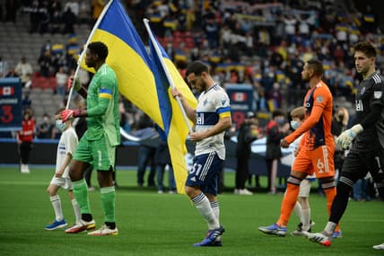 Mar 5, 2022; Vancouver, British Columbia, CAN; New York City FC goalkeeper Sean Johnson (1) and Vancouver Whitecaps forward Russell Teibert (31) walk onto the pitch before the start of the first half at BC Place. Mandatory Credit: Anne-Marie Sorvin-USA TODAY Sports