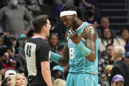 Mar 5, 2022; Charlotte, North Carolina, USA; Charlotte Hornets center Montrezl Harrell (8) talks with referee Ben Taylor (46) during the second quarter against the San Antonio Spurs at the Spectrum Center. Mandatory Credit: Jim Dedmon-USA TODAY Sports