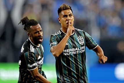 Mar 5, 2022; Charlotte, North Carolina, USA; Los Angeles Galaxy midfielder Efrain Alvarez (26) celebrates scoring a goal against the Los Angeles Galaxy during the second half at Bank of America Stadium. Mandatory Credit: Nell Redmond-USA TODAY Sports