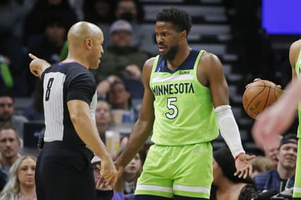Mar 5, 2022; Minneapolis, Minnesota, USA; Minnesota Timberwolves guard Malik Beasley (5) questions being ejected by referee Marc Davis in the game with the Portland Trail Blazers at Target Center. Mandatory Credit: Bruce Kluckhohn-USA TODAY Sports