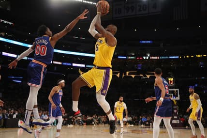 Mar 5, 2022; Los Angeles, California, USA; Los Angeles Lakers forward LeBron James (6) shoots the ball over Golden State Warriors forward Jonathan Kuminga (00) during the second half at Crypto.com Arena. The Lakers won 124-116. Mandatory Credit: Kiyoshi Mio-USA TODAY Sports