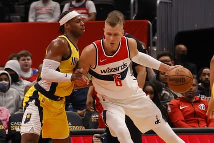 Mar 6, 2022; Washington, District of Columbia, USA; Washington Wizards center Kristaps Porzingis (6) dribbles the ball as Indiana Pacers forward Isaiah Jackson (23) defends in the first quarter at Capital One Arena. Mandatory Credit: Geoff Burke-USA TODAY Sports