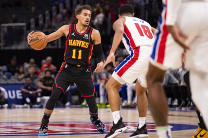 Mar 7, 2022; Detroit, Michigan, USA; Atlanta Hawks guard Trae Young (11) gets defended by Detroit Pistons guard Cory Joseph (18) during the first quarter at Little Caesars Arena. Mandatory Credit: Raj Mehta-USA TODAY Sports