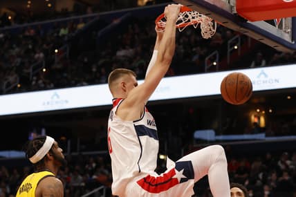 Mar 6, 2022; Washington, District of Columbia, USA; Washington Wizards center Kristaps Porzingis (6) dunks the ball as Indiana Pacers forward Oshae Brissett (12) looks on at Capital One Arena. Mandatory Credit: Geoff Burke-USA TODAY Sports