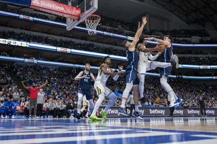 Mar 7, 2022; Dallas, Texas, USA; Dallas Mavericks forward Maxi Kleber (42) andguard Luka Doncic (77) defend against Utah Jazz guard Donovan Mitchell (45) during the first quarter at the American Airlines Center. Mandatory Credit: Jerome Miron-USA TODAY Sports
