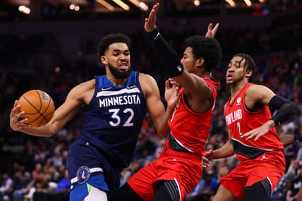 Mar 7, 2022; Minneapolis, Minnesota, USA; Minnesota Timberwolves center Karl-Anthony Towns (32) drives to the basket as Portland Trail Blazers guard Brandon Williams (8) guards him during the third quarter at Target Center. Mandatory Credit: Harrison Barden-USA TODAY Sports