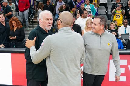 Mar 7, 2022; San Antonio, Texas, USA;  San Antonio Spurs head coach Gregg Popovich is congratulated by Los Angeles Lakers head coach Frank Vogel and assistant coach David Fizdale after tying the record for most wins by a head coach after the Spurs defeated the Lakers 117-110 at the AT&T Center. Mandatory Credit: Daniel Dunn-USA TODAY Sports