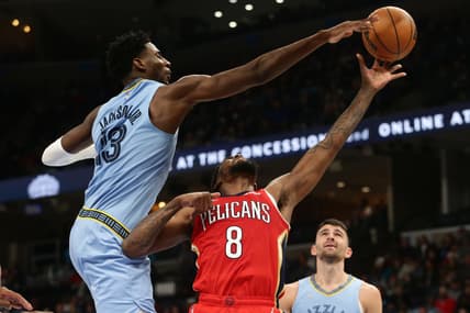Mar 8, 2022; Memphis, Tennessee, USA; Memphis Grizzlies forward Jaren Jackson Jr. (13) blocks the shot of New Orleans Pelicans forward Naji Marshall (8) during the second half at FedExForum. Mandatory Credit: Petre Thomas-USA TODAY Sports