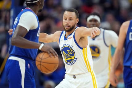 Mar 8, 2022; San Francisco, California, USA; Golden State Warriors guard Stephen Curry (30) defends LA Clippers guard Reggie Jackson (1) during the second quarter at Chase Center. Mandatory Credit: Darren Yamashita-USA TODAY Sports