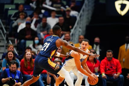 Mar 9, 2022; New Orleans, Louisiana, USA; Orlando Magic guard Jalen Suggs (4) fights for position against New Orleans Pelicans forward Tony Snell (21) during the first quarter at Smoothie King Center. Mandatory Credit: Andrew Wevers-USA TODAY Sports