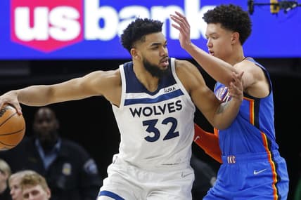 Mar 9, 2022; Minneapolis, Minnesota, USA; Minnesota Timberwolves center Karl-Anthony Towns (32) works for baseline position against Oklahoma City Thunder center Isaiah Roby (22) in the second quarter at Target Center. Mandatory Credit: Bruce Kluckhohn-USA TODAY Sports