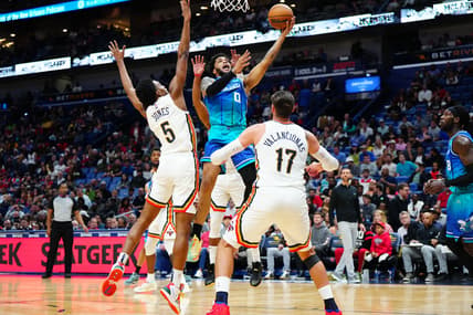 Mar 11, 2022; New Orleans, Louisiana, USA; Charlotte Hornets forward Miles Bridges (0) shoots the ball against New Orleans Pelicans forward Herbert Jones (5) during the second quarter at Smoothie King Center. Mandatory Credit: Andrew Wevers-USA TODAY Sports