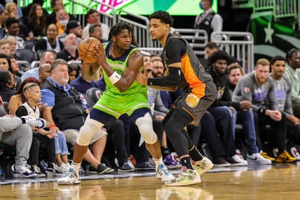 Mar 11, 2022; Orlando, Florida, USA; Minnesota Timberwolves forward Anthony Edwards (1) moves the ball against Orlando Magic forward Chuma Okeke (3) during the second half at Amway Center. Mandatory Credit: Mike Watters-USA TODAY Sports