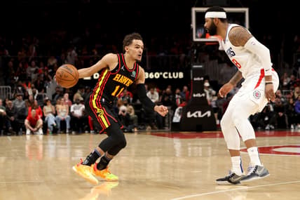 Mar 11, 2022; Atlanta, Georgia, USA; Atlanta Hawks guard Trae Young (11) drives against LA Clippers forward Marcus Morris Sr. (8) during the second quarter at State Farm Arena. Mandatory Credit: Jason Getz-USA TODAY Sports