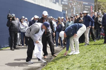 Mar 12, 2022; Ponte Vedra Beach, Florida, USA; Daniel Berger sets his ball after getting relief on the 18th hole during the first round of THE PLAYERS Championship golf tournament. Mandatory Credit: David Yeazell-USA TODAY Sports