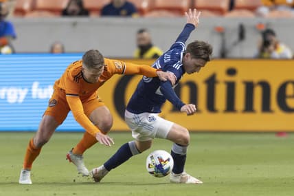 Mar 12, 2022; Houston, Texas, USA;  Houston Dynamo FC defender Adam Lundkvist (3) chases Vancouver Whitecaps FC midfielder Ryan Gauld (25) in the  first half at PNC Stadium. Mandatory Credit: Thomas Shea-USA TODAY Sports