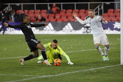Mar 12, 2022; Washington, District of Columbia, USA; D.C. United forward Ola Kamara (9) shoots the ball on Chicago Fire goalkeeper Gabriel Slonina (1) during the first half at Audi Field. Mandatory Credit: Geoff Burke-USA TODAY Sports