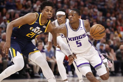 Mar 12, 2022; Salt Lake City, Utah, USA; Sacramento Kings guard De'Aaron Fox (5) drives against Utah Jazz center Hassan Whiteside (21) in the second quarter at Vivint Arena. Mandatory Credit: Jeffrey Swinger-USA TODAY Sports