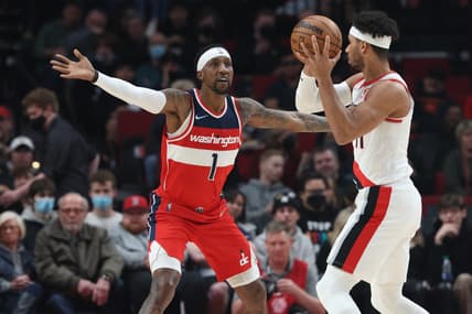 Mar 12, 2022; Portland, Oregon, USA; Washington Wizards forward Kentavious Caldwell-Pope (1) guards Portland Trail Blazers guard Josh Hart (11) during the first quarter at Moda Center. Mandatory Credit: Al Sermeno-USA TODAY Sports