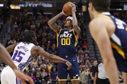 Mar 12, 2022; Salt Lake City, Utah, USA; Utah Jazz guard Jordan Clarkson (00) looks to shoot in the fourth quarter against Sacramento Kings guard Davion Mitchell (15)  at Vivint Arena. Mandatory Credit: Jeffrey Swinger-USA TODAY Sports