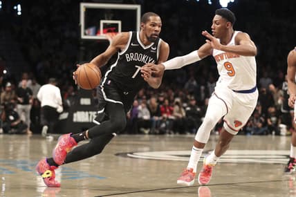 Mar 13, 2022; Brooklyn, New York, USA;  Brooklyn Nets forward Kevin Durant (7) drives against New York Knicks guard RJ Barrett (9) in the fourth quarter at Barclays Center. Mandatory Credit: Wendell Cruz-USA TODAY Sports
